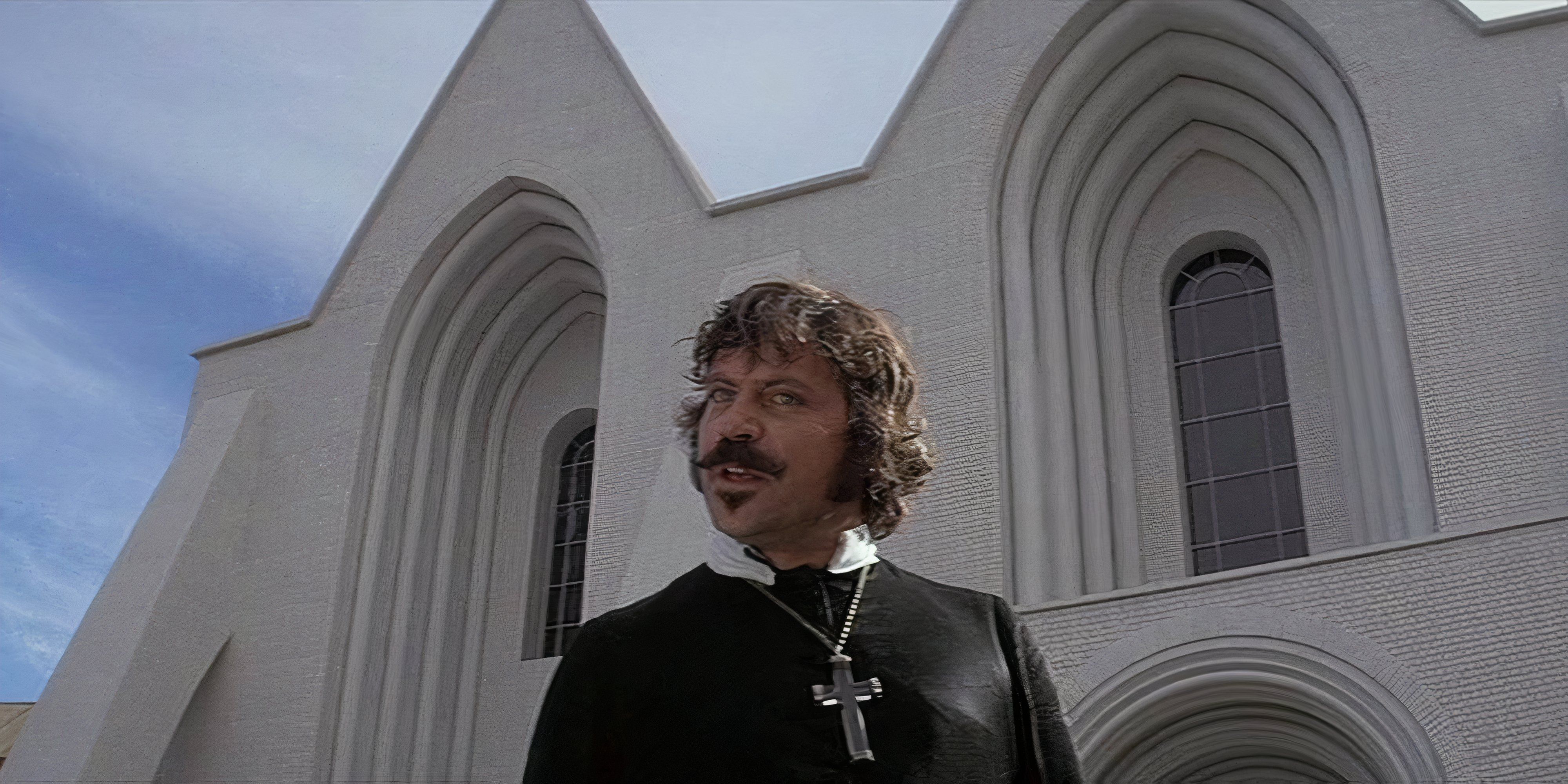 10 Movies Warhammer 40k Fans Should Watch A Priest stands in front of a church