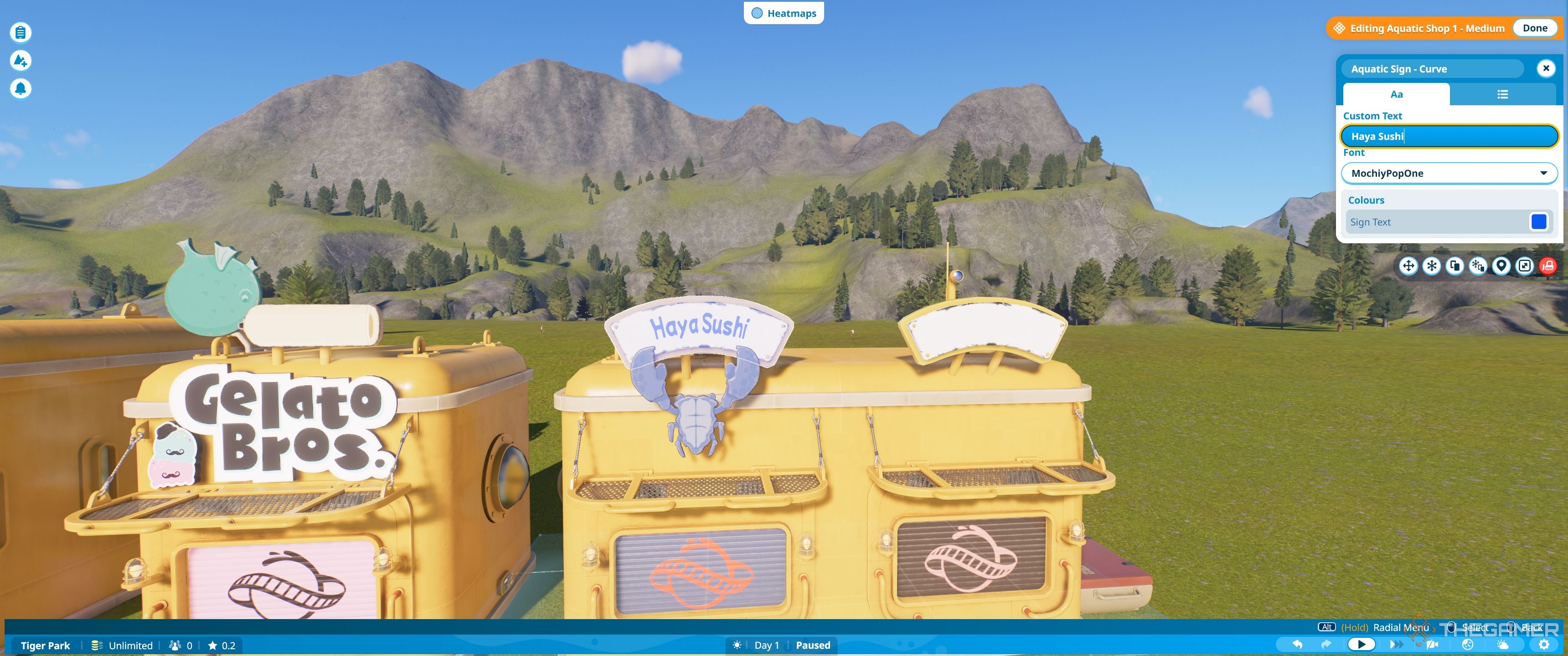 Planet Coaster Aquatic Shell With text editor open for sushi store.