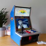 Side view of Evercade Alpha with Ryu from Street Fighter Alpha 3 on screen