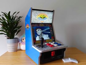 Side view of Evercade Alpha with Ryu from Street Fighter Alpha 3 on screen