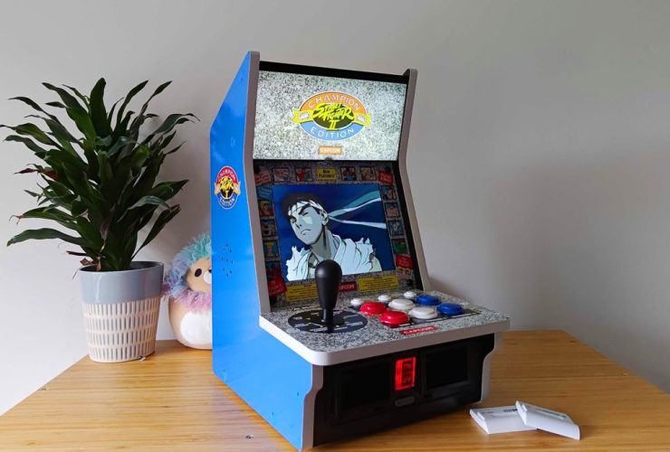 Side view of Evercade Alpha with Ryu from Street Fighter Alpha 3 on screen