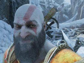 Kratos makes a sly expression in God of War Ragnarok