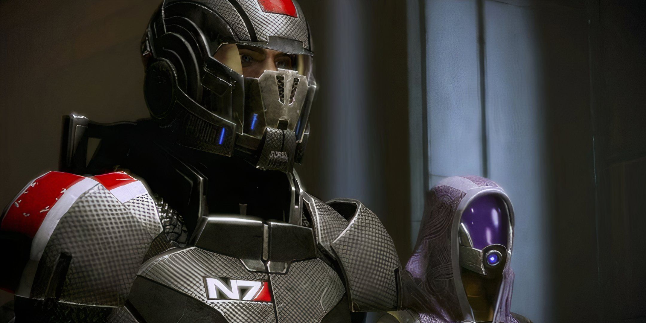 Male Shepard and Tali standing side by side. 