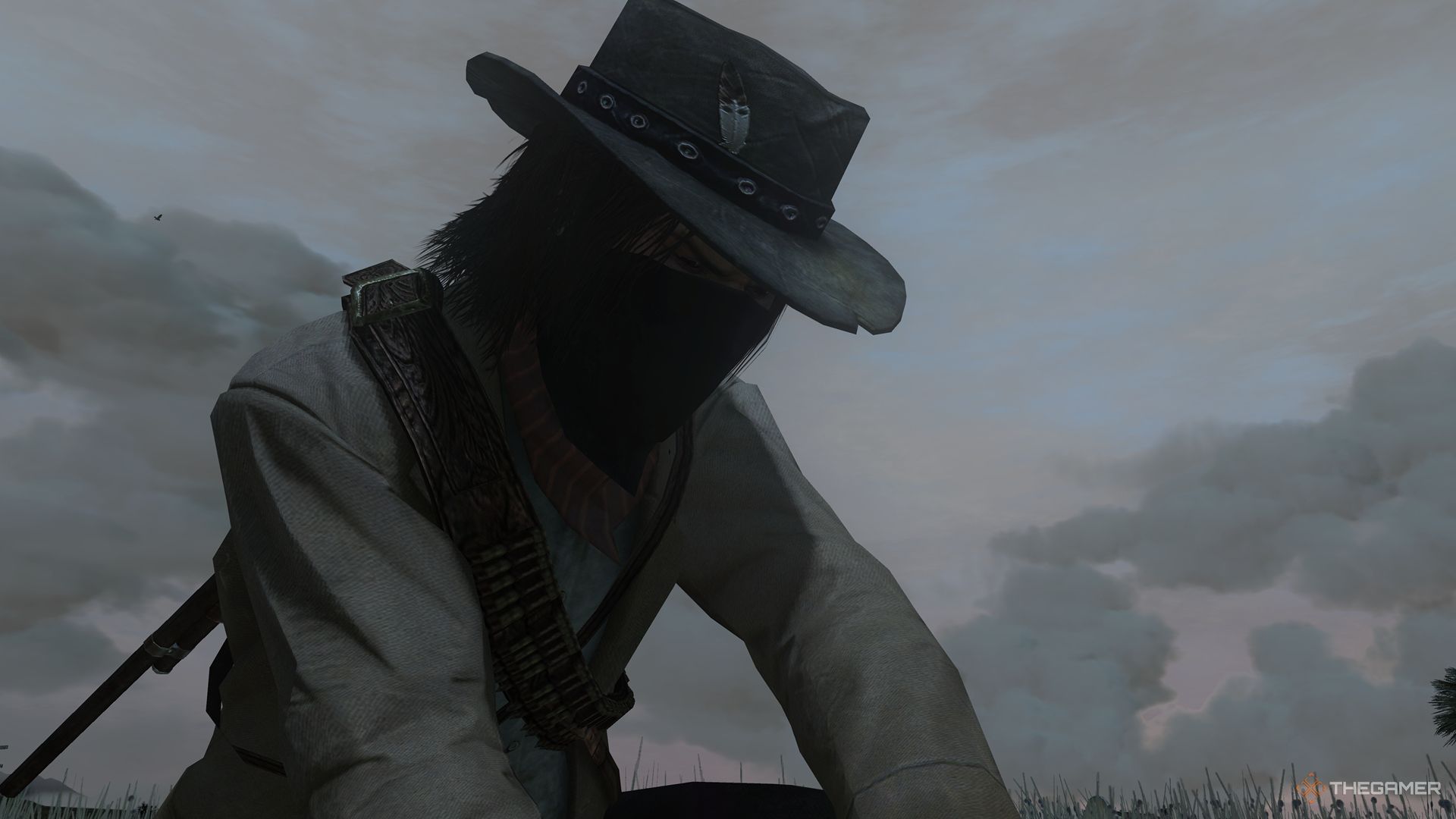 Red Dead Redemption screenshot of Jack Marston in the animal skinning animation.