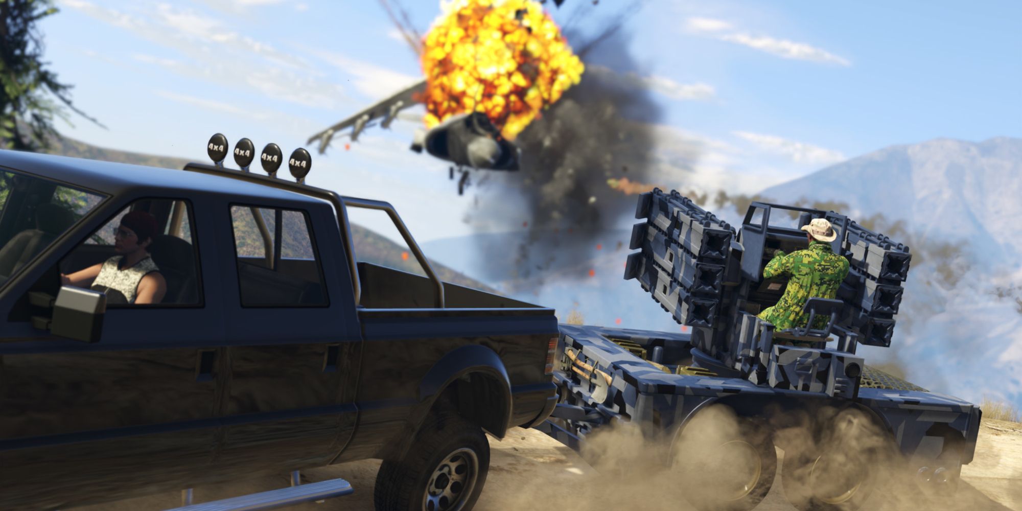 Two players in vehicle combat blowing up a fighter jet with rockets in Grand Theft Auto Online.