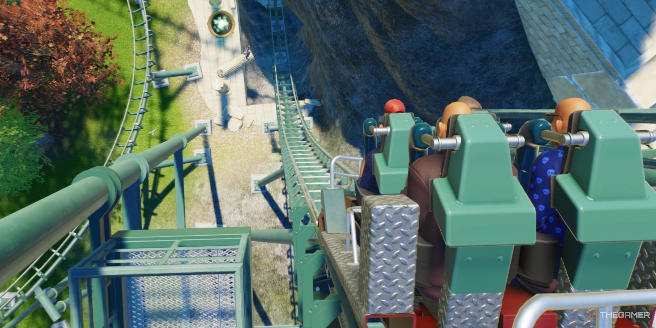 The guests are seated in a coaster about to start in planet coaster 2.