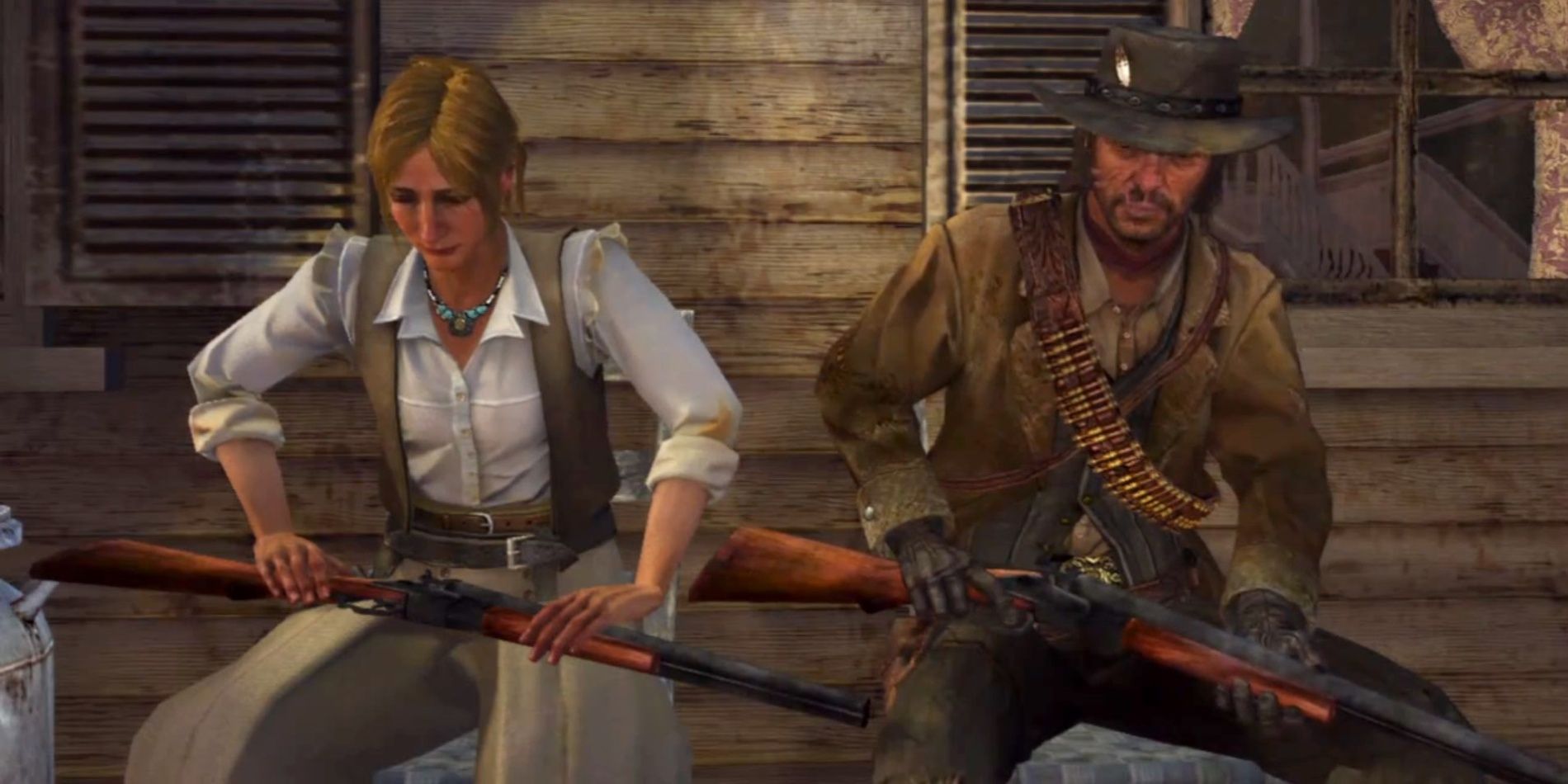 Red Dead Redemption screenshot of Bonnie MacFarlane sitting with John Marston holding guns.