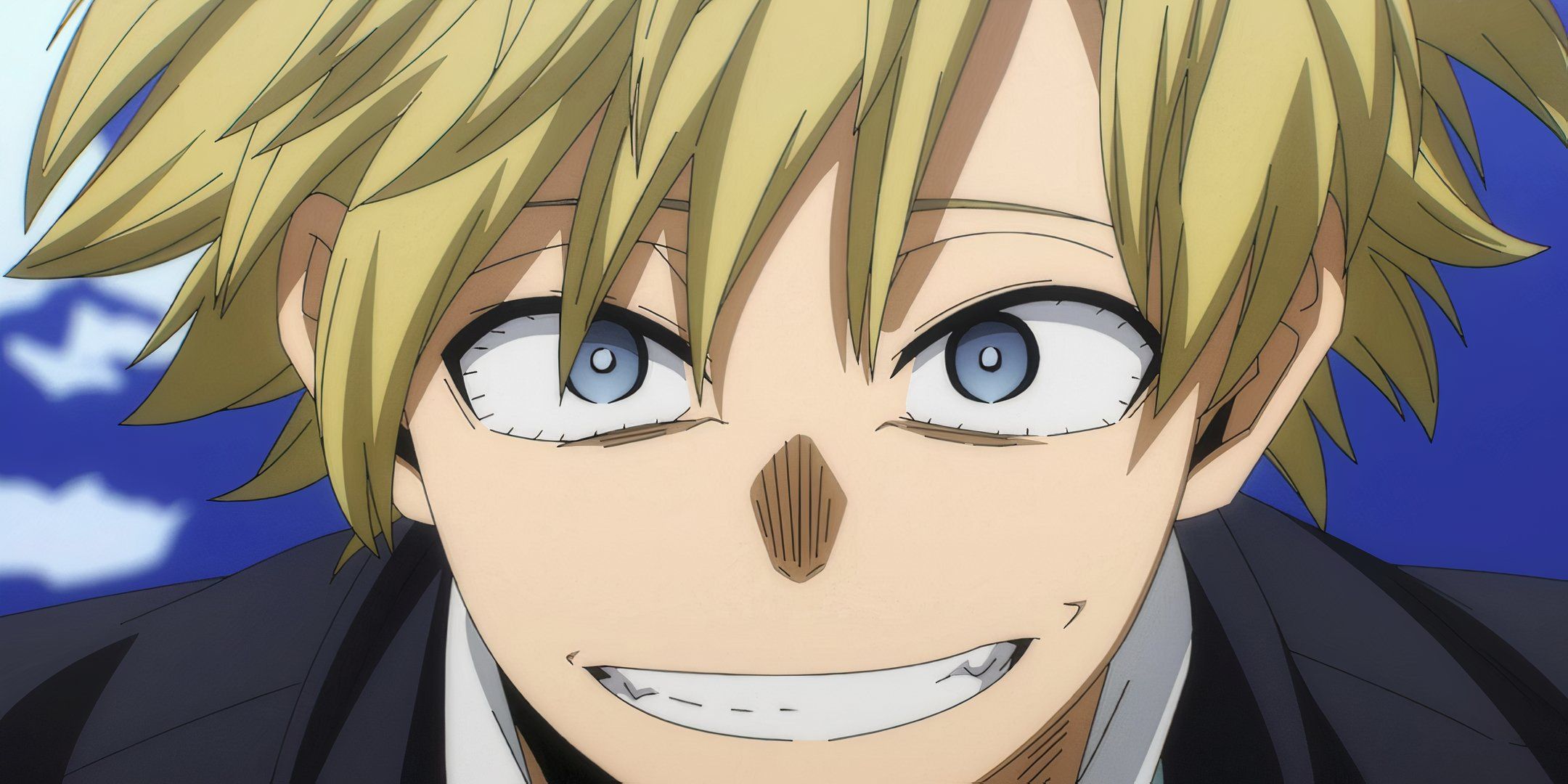 Neito Monoma smiles intensely in costume. 