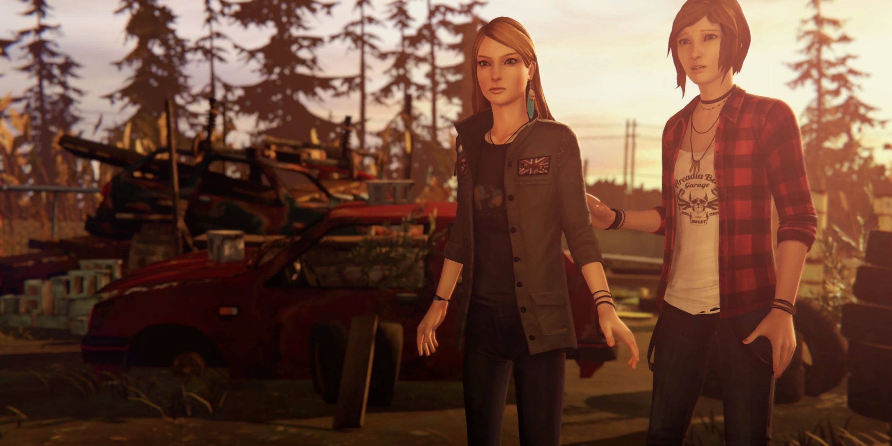 Chloe and Rachel stand next to each other in a junkyard at sunset.