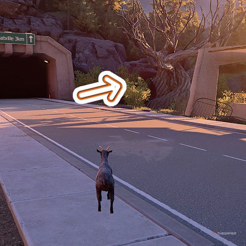 An orange arrow shows the tree next to a tunnel in Goat Simulator Remastered