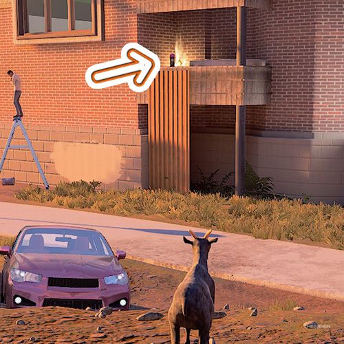 An orange arrow shows the location on a balcony in Goat Simulator Remastered