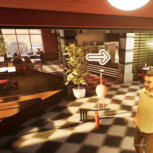 An orange arrow points the trophy that is inside a fast food restaurant in Goat Simulator Remastered