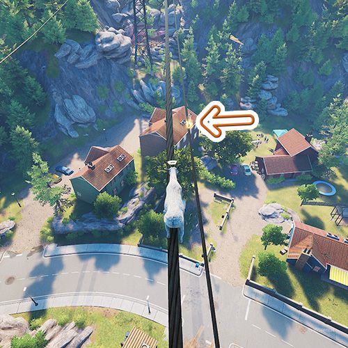 An orange arrow points the trophy that is on a transmission tower's wire in Goat Simulator Remastered