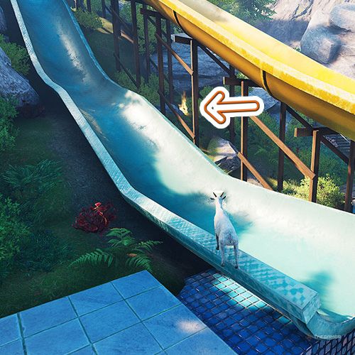 An orange arrow points the trophy that is under a yellow colored water slide in Goat Simulator Remastered