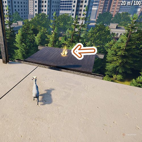 An orange arrow points the trophy that is located on a top floor of a construction in Goat Simulator Remastered