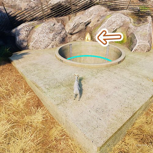 An orange arrow points the trophy that is next to a deep hole among the wheat fields in Goat Simulator Remastered