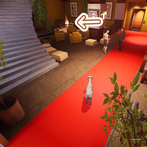 An orange arrow points the trophy that is inside a hotel's left corner in Goat Simulator Remastered