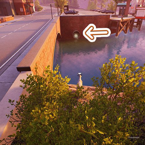 An orange arrow points a sewer entrance near a canal in Goat Simulator Remastered