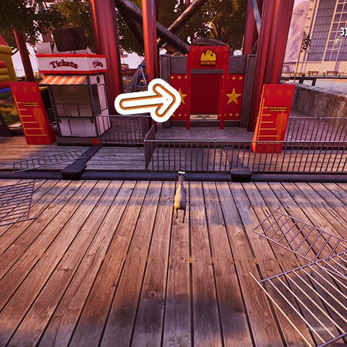 An orange arrow points a red elevator next to a ticket booth in Goat Simulator Remastered