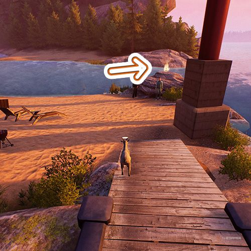 An orange arrow points the trophy that is on a rock which is inside an amusement park in Goat Simulator Remastered