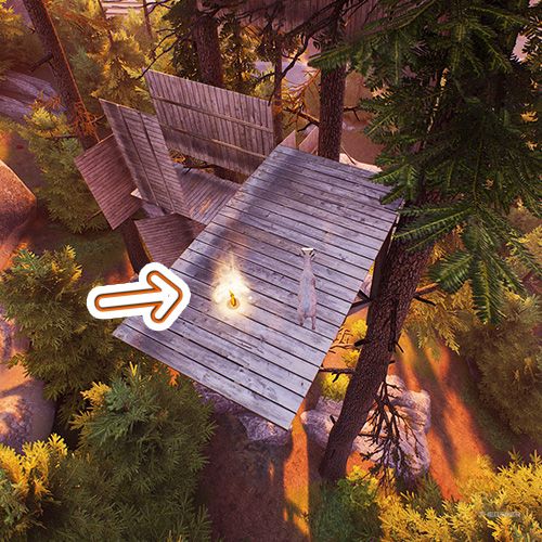 An orange arrow points the trophy that is on top of a wooden platform course in Goat Simulator Remastered