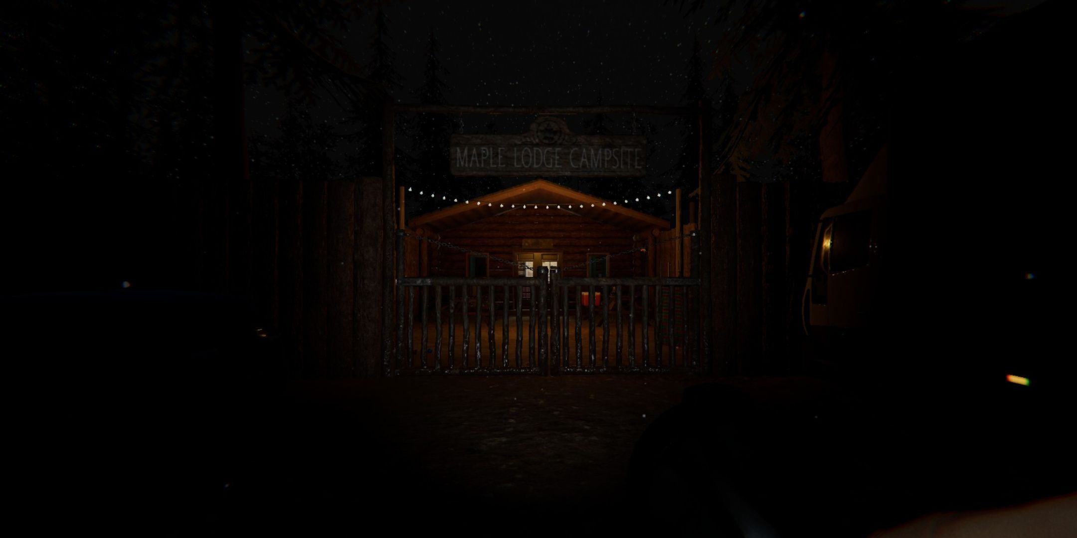 Phasmophobia, the entry to the Maple Lodge Campsite, with the string of lights turned on and the office lights turned on.