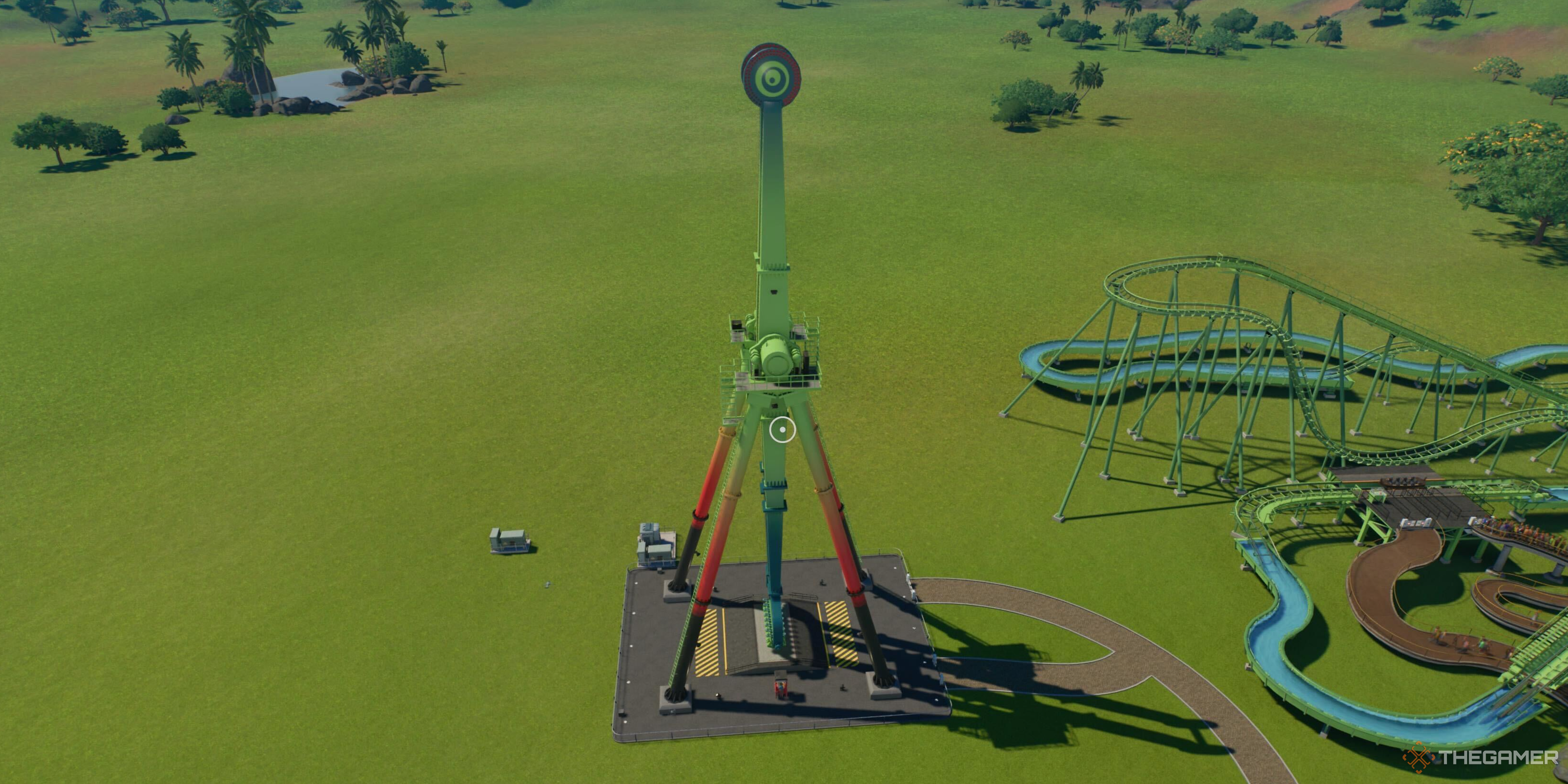 A tall flat ride in Planet Coaster 2.