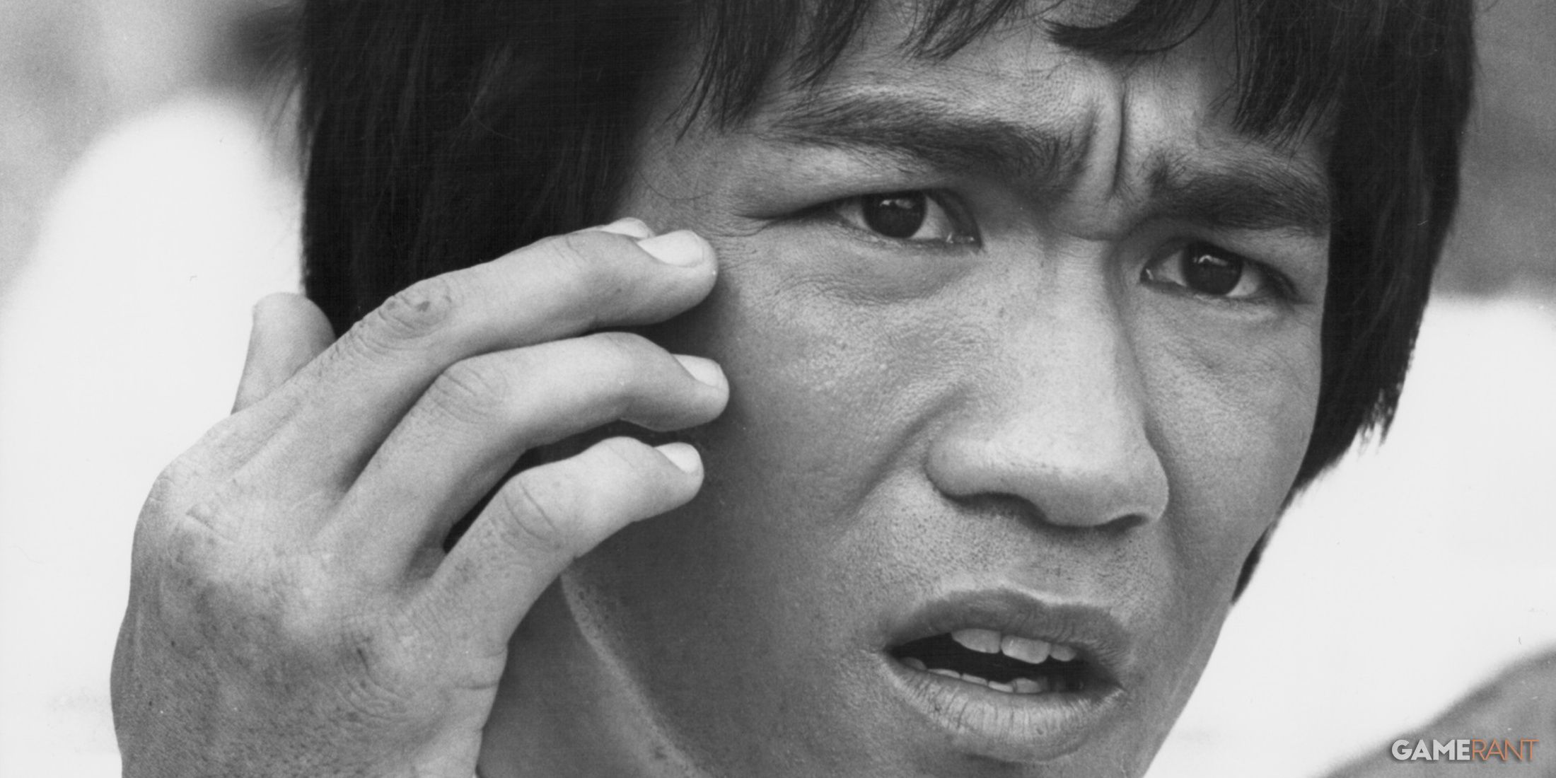 a close up of bruce lee in a black and white picture-1