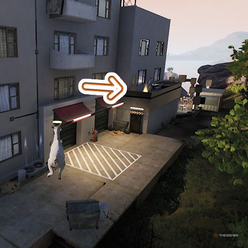 An orange arrow points the trophy that is next to a man on the balcony in Goat Simulator Remastered