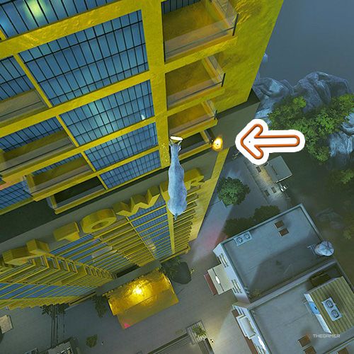 An orange arrow points the trophy that is inside a balcony which belongs to Golden Tower in Goat Simulator Remastered