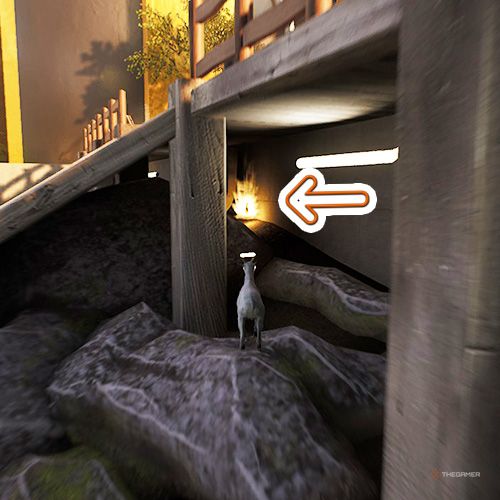 An orange arrow points the trophy that is under a wooden ramp in Goat Simulator Remastered