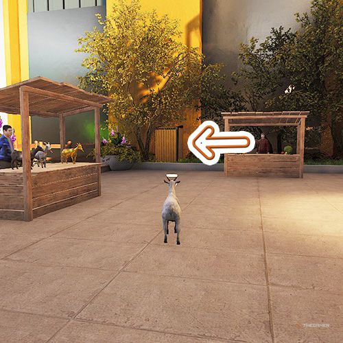 An orange arrow points the trophy that is inside the metal shed next to hotel's wall in Goat Simulator Remastered