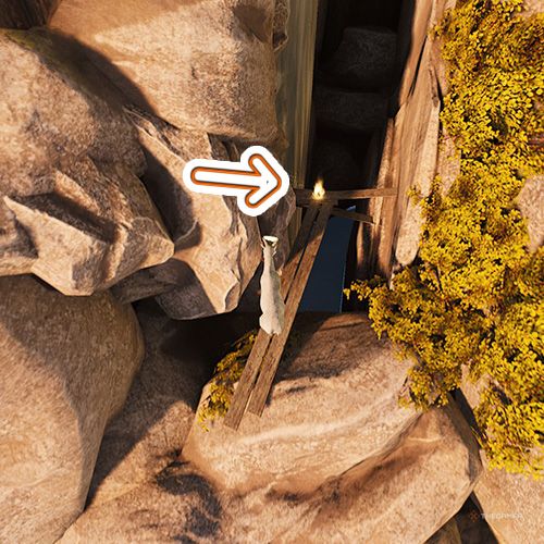 An orange arrow points the trophy that is on a plank whick is between the rocks in Goat Simulator Remastered