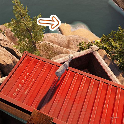 An orange arrow points the trophy that is beneath a red container and on the shoreline in Goat Simulator Remastered