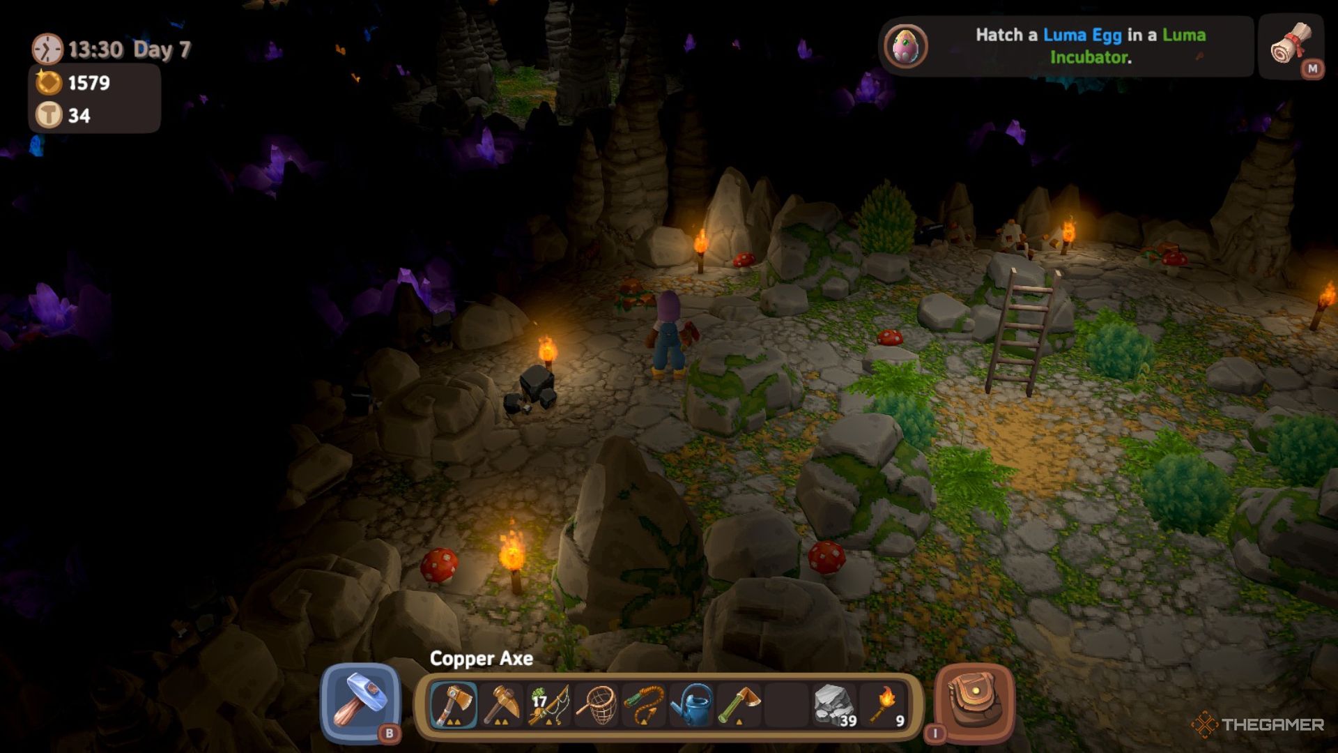 Player character standing in the farm caves and surrounded by several torches in Luma Island.