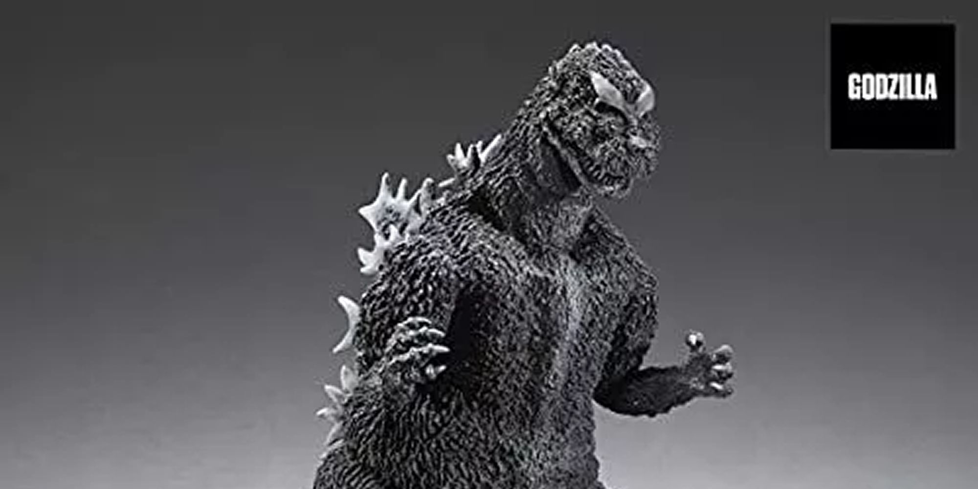 The standing giant Godzilla toy.