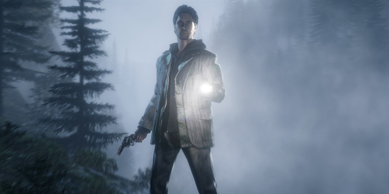 Alan Wake, clad in a tweed suit and holding a flashlight and revolver, looks at the camera in a forest setting.