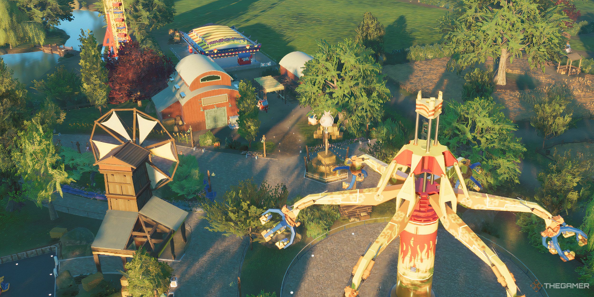 A farmland park with coasters, rides, and windmills.