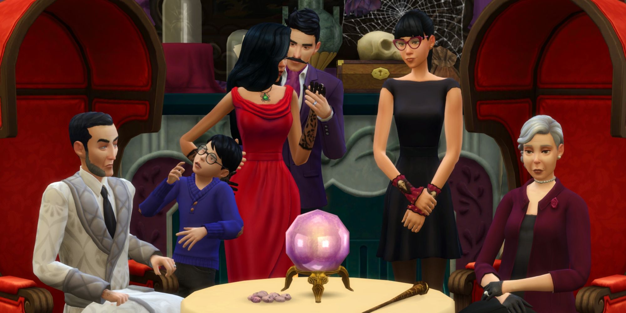 The Sims 4 screenshot of the Goth Family sat around a table.