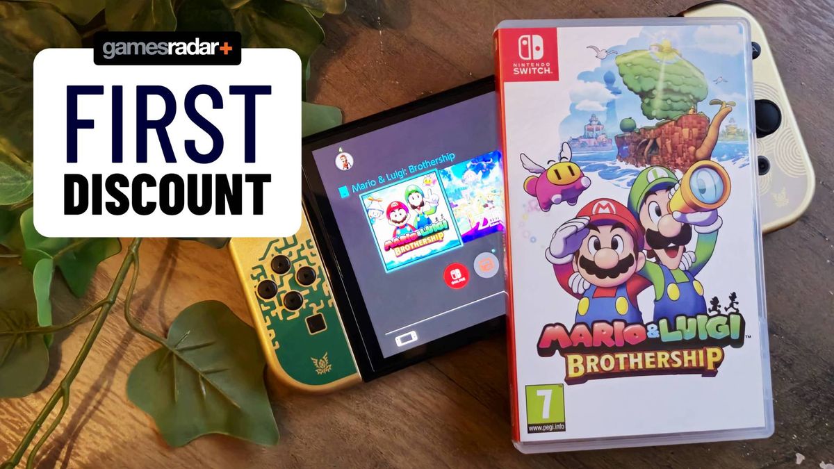 Image of box for Mario &amp; Luigi: Brothership for the Switch sitting on top of an OLED Switch while on a wooden table.