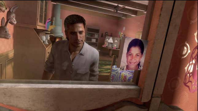 A man looks at a picture of a young woman in a mirror.