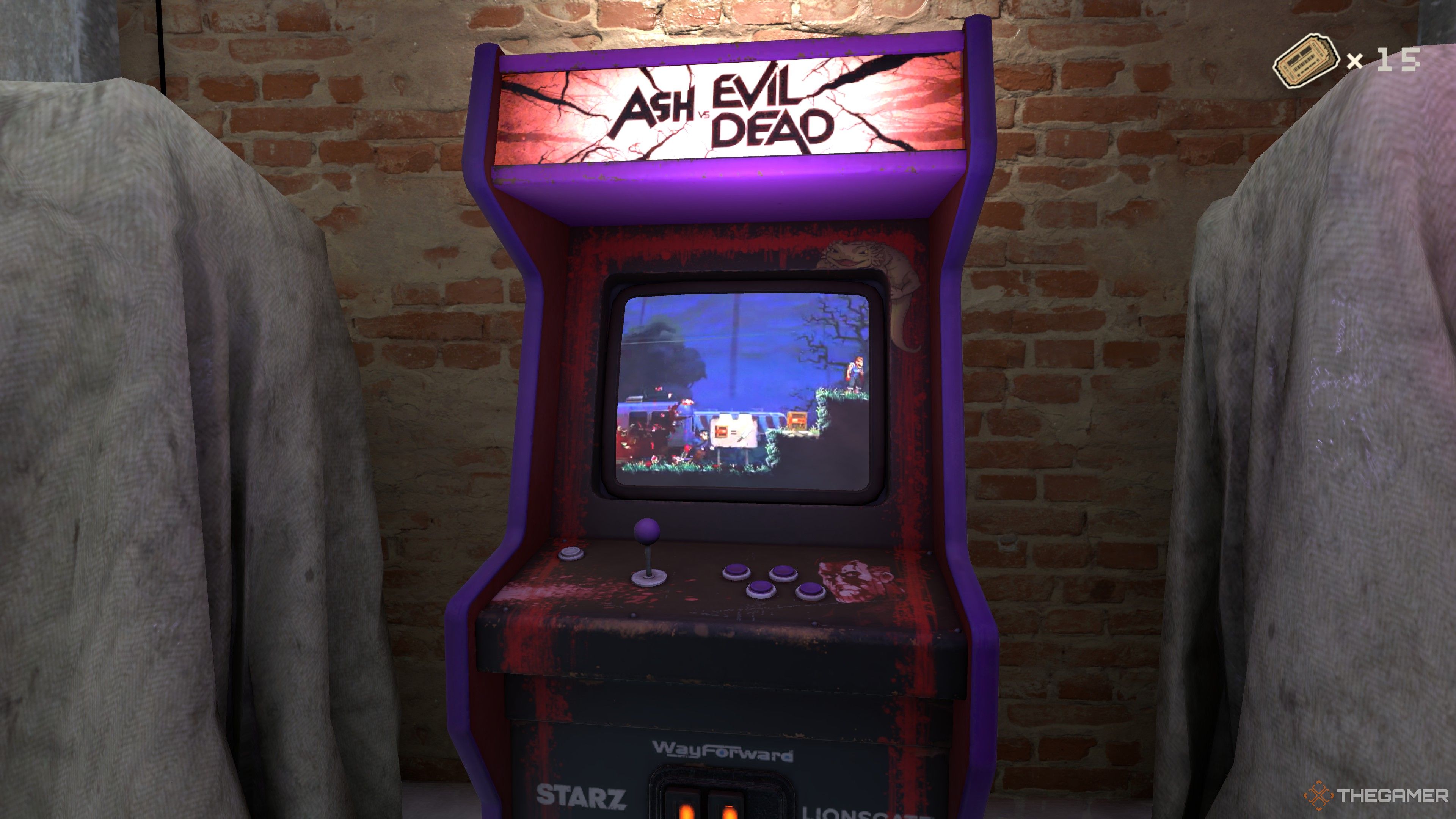 RetroRealms Arcade Ash vs. Evil Dead cabinet against a brick wall, sandwiched between two other cabinets covered in grey tarps.