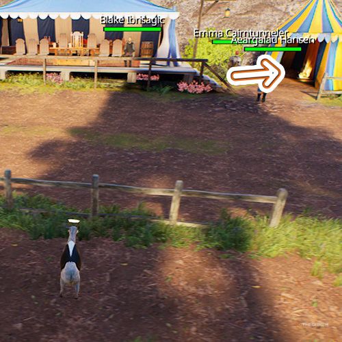 An orange arrow points the trophy that is inside a yellow and blue coloured tent in Goat Simulator Remastered