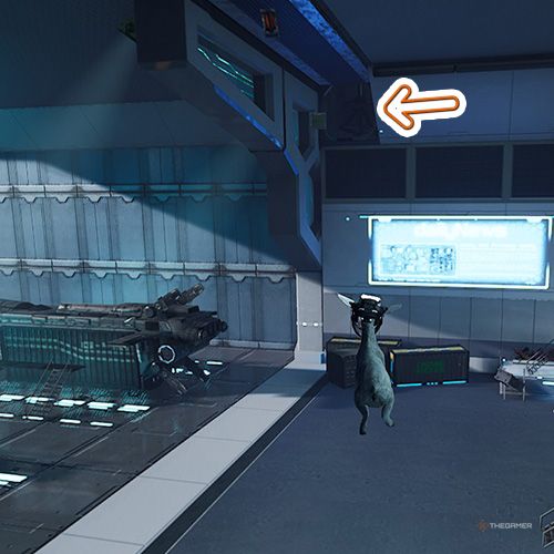 An orange arrow points the secret spot entrance which is above the blue hologram screen in Goat Simulator Remastered