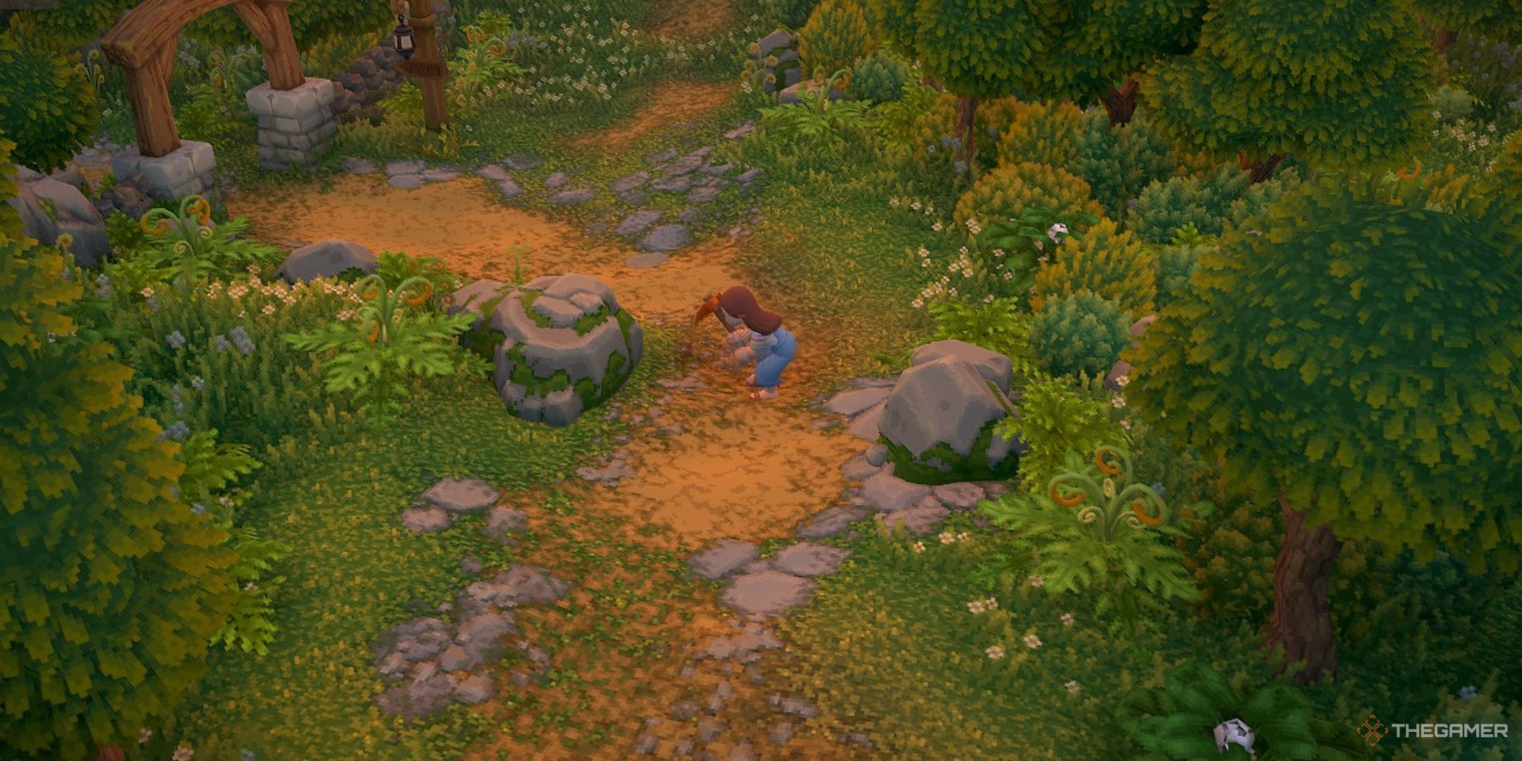 Player character using a pickaxe to hit a nearby Farm Rock in Luma Island.