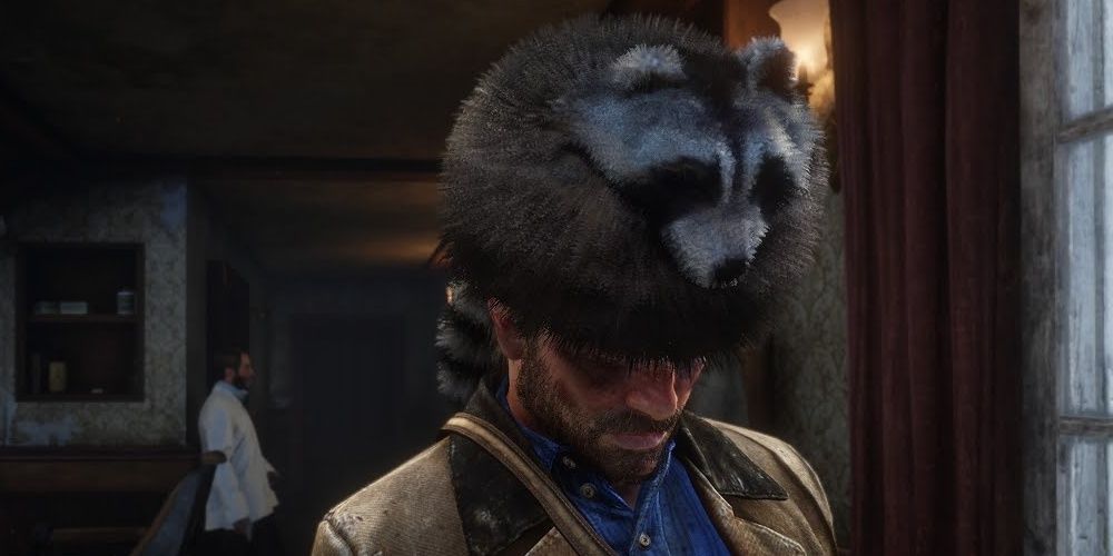 Arthur in a raccoon hat in Red Dead Redemption 2 the video game