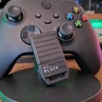 WD Black C50 Xbox storage card leaning on a Series X controller