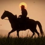 Red Dead Redemption 2 screenshot showing the silhouette of a man with a cowboy hat on horseback, a glowing sun seen behind him