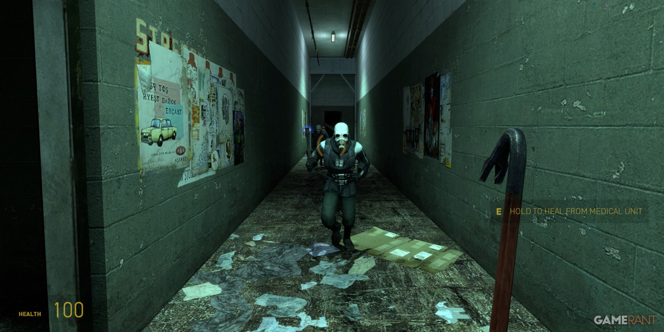 Combine soldier charging in a dark hallway with a stun baton in Half-Life 2