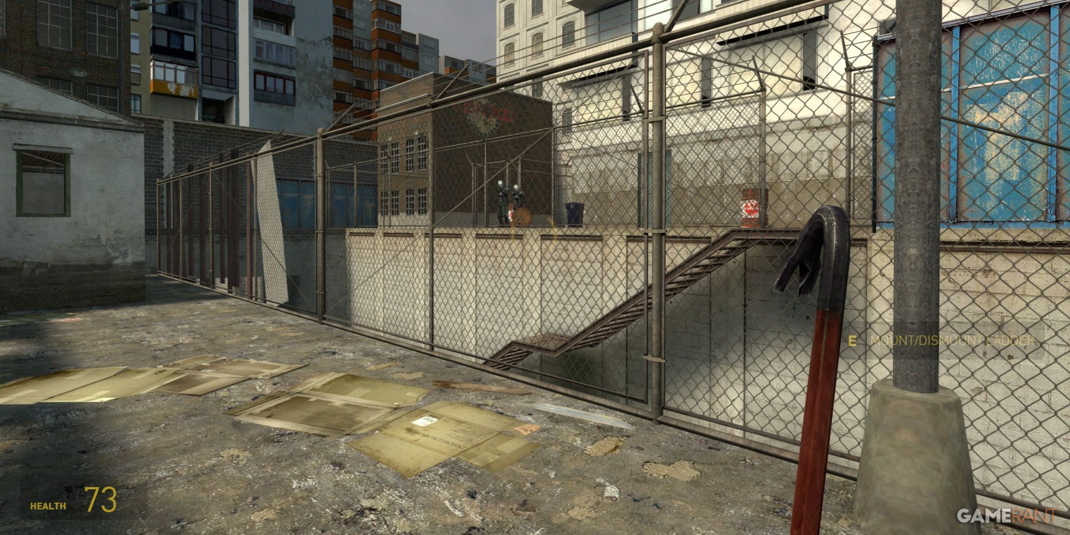 Crowbar leaning on a chain-link fence in an urban alley in Half-Life 2